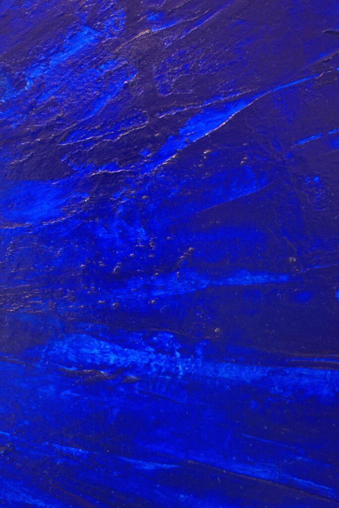Close-up on the large-scale deep blue painting, focusing on the underwater lights.